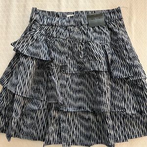 Very cute cotton ruffled skirt with elastic waist band.